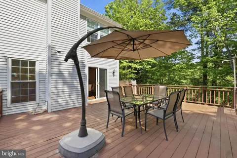 a view of a dinning table and chairs in the patio