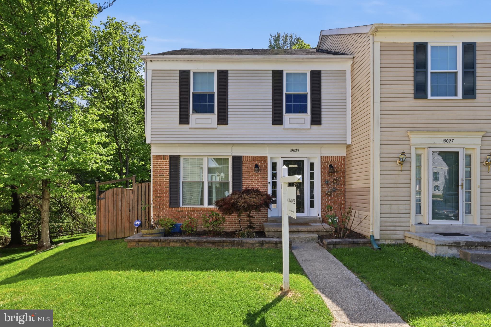 15029 Shamrock Ridge Road Silver Spring, MD 20906 - Photo 2 of 44 a front view of a house with a yard and large tree