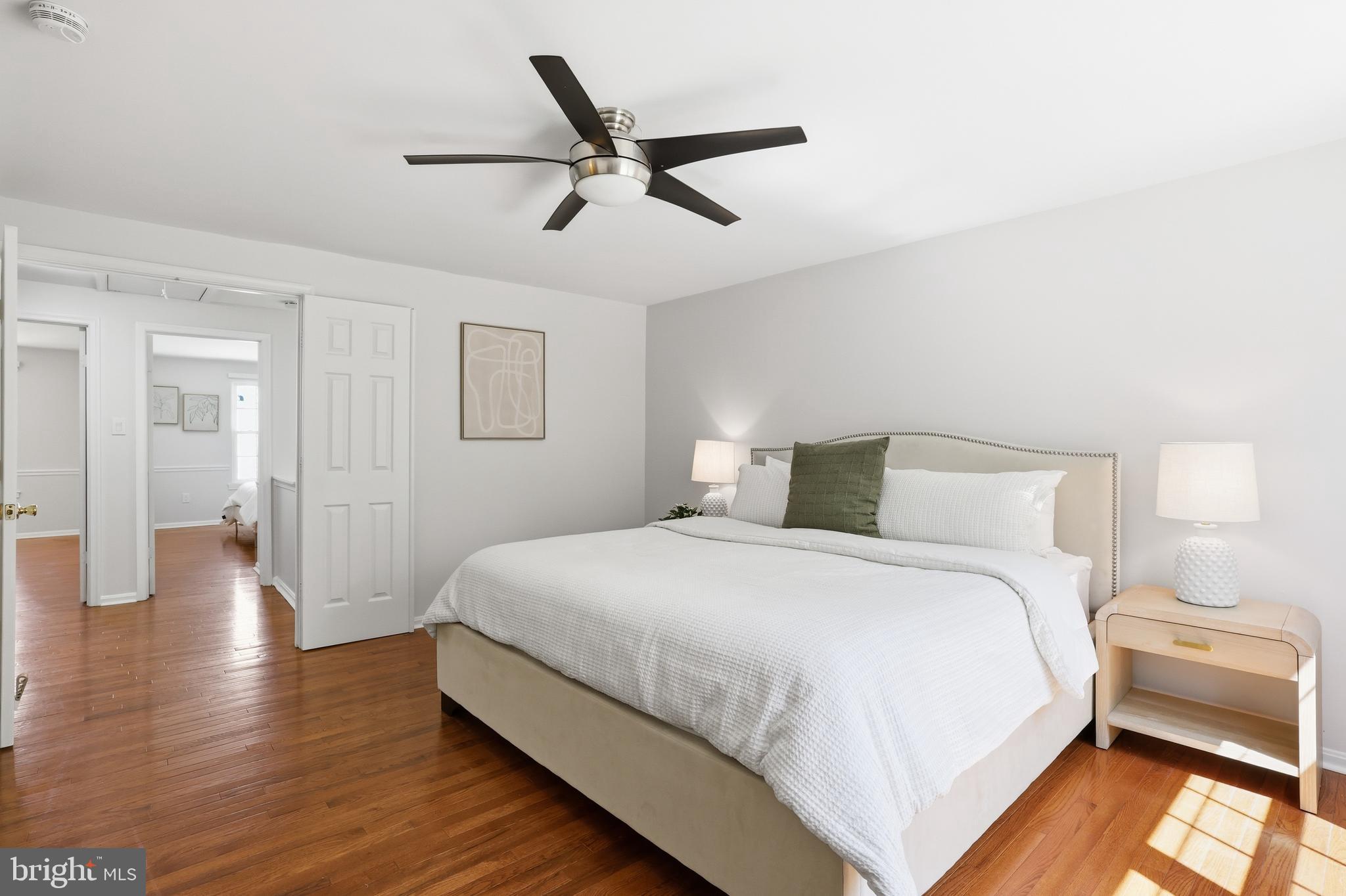 15029 Shamrock Ridge Road Silver Spring, MD 20906 - Photo 22 of 44 a bedroom with a bed and a chandelier