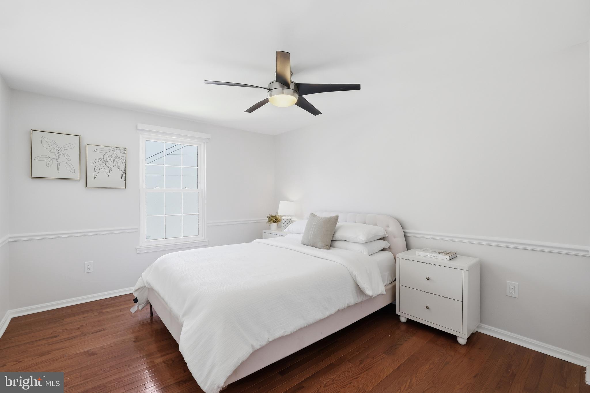 15029 Shamrock Ridge Road Silver Spring, MD 20906 - Photo 27 of 44 a bedroom with a bed and a ceiling fan
