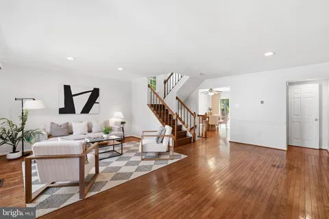 a livingroom with furniture and stairs