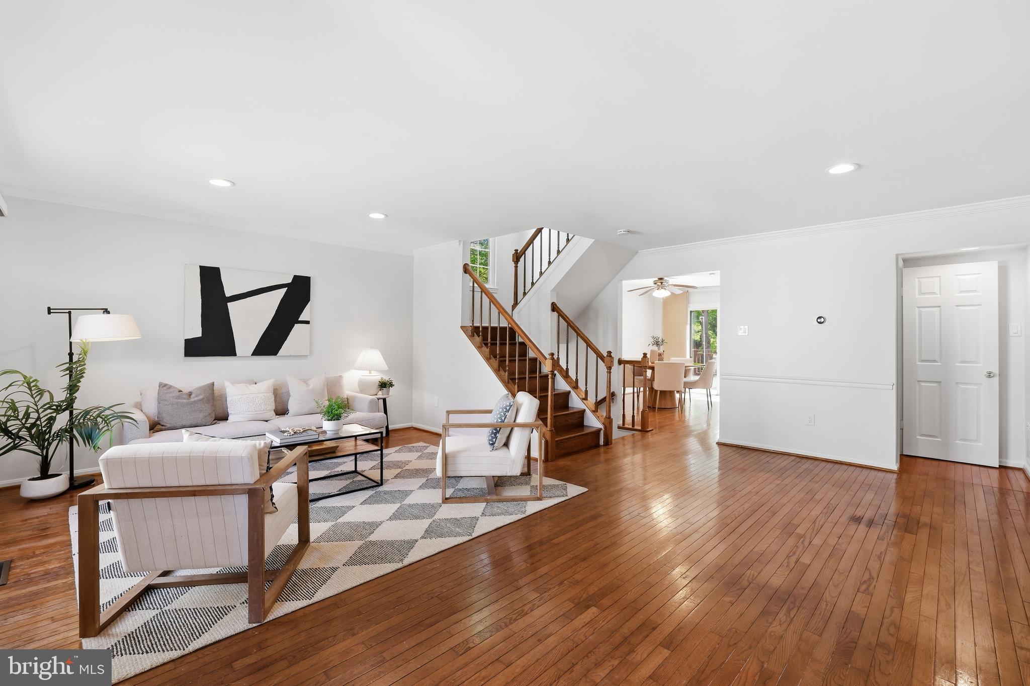 15029 Shamrock Ridge Road Silver Spring, MD 20906 - Photo 3 of 44 a livingroom with furniture and stairs