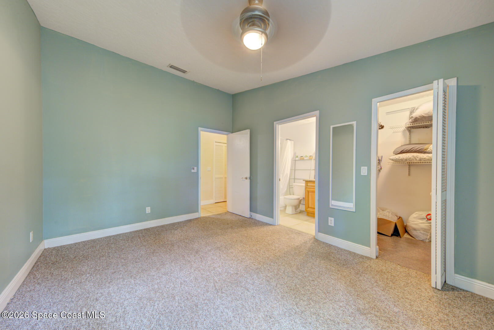 7667 North Wickham Road, Unit 1416 Melbourne, FL 32940 - Photo 11 of 41 primary bedroom with ensuite