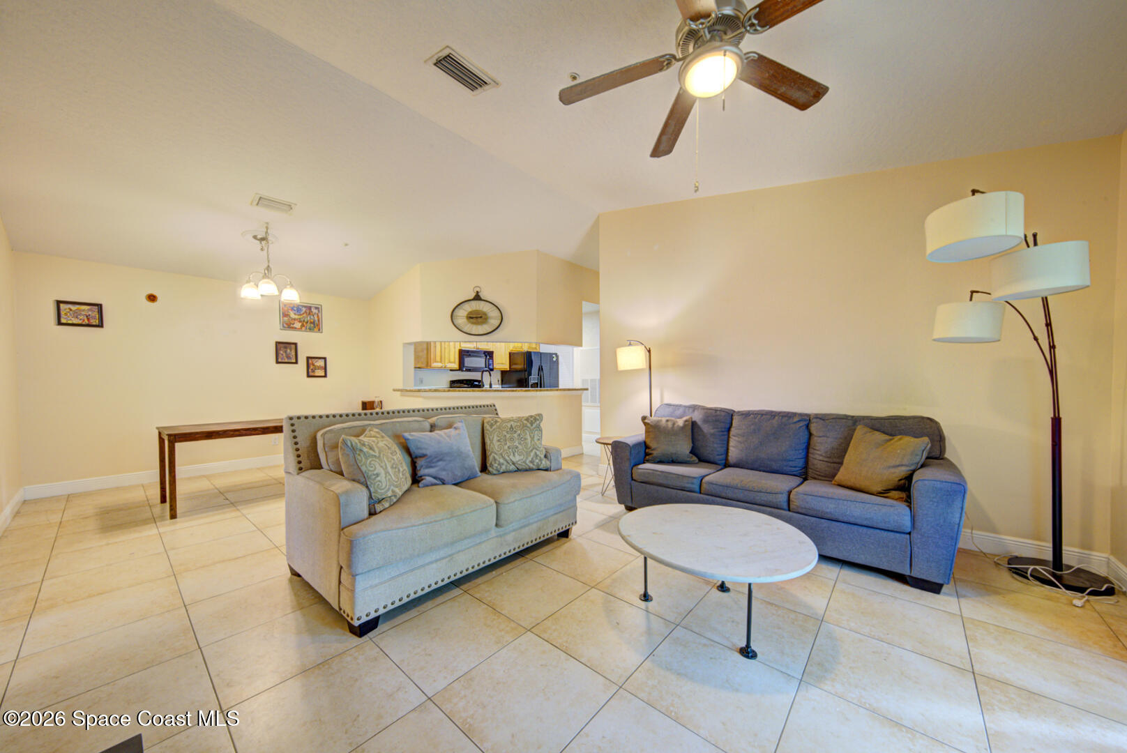 7667 North Wickham Road, Unit 1416 Melbourne, FL 32940 - Photo 18 of 41 living room with vaulted ceiling