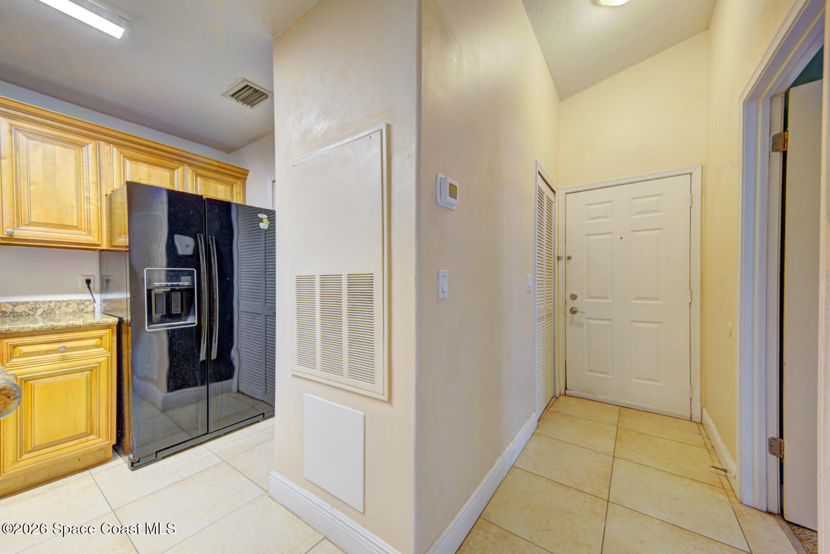 7667 North Wickham Road, Unit 1416 Melbourne, FL 32940 - Photo 4 of 41 foyer & kitchen