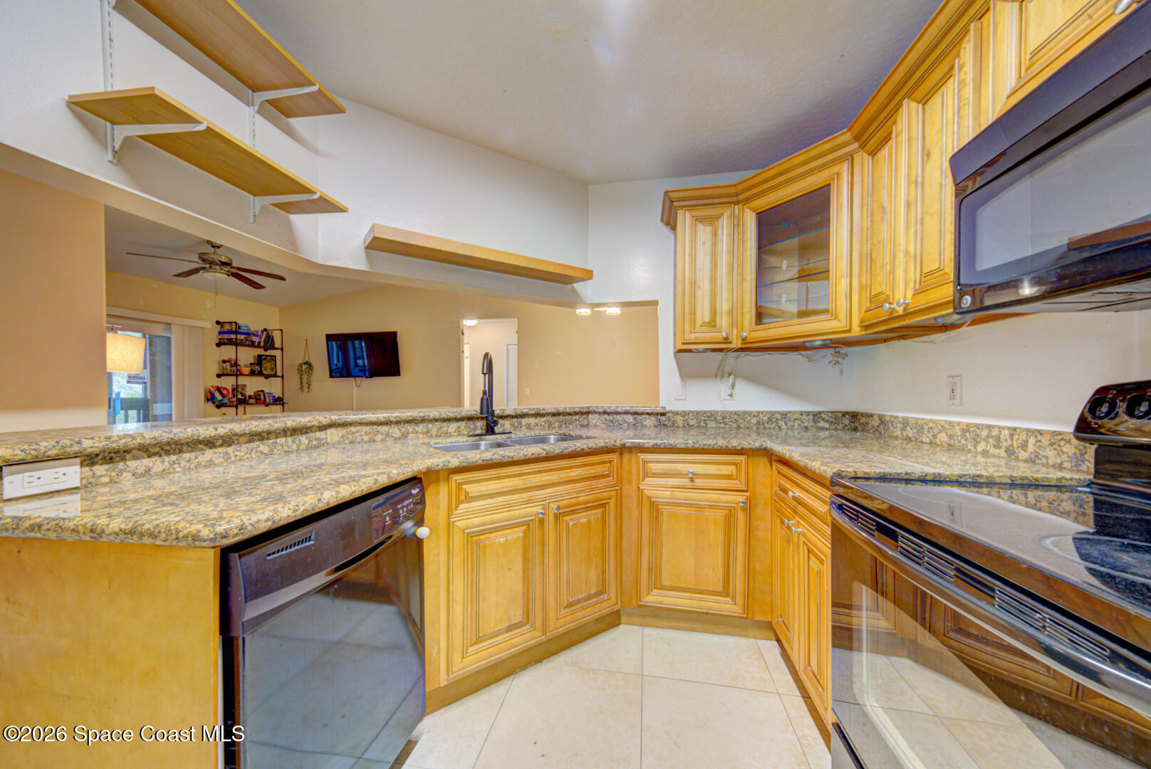7667 North Wickham Road, Unit 1416 Melbourne, FL 32940 - Photo 6 of 41 kitchen with black appliances