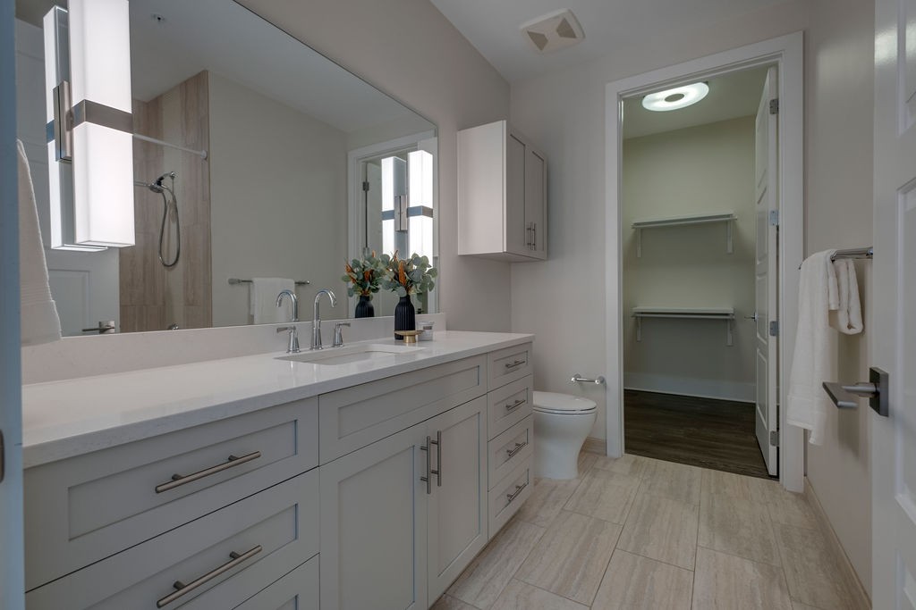 20 Rutledge Street, Unit 111 Nashville, TN 37210 - Photo 13 of 32 a bathroom with a double vanity sink and mirror