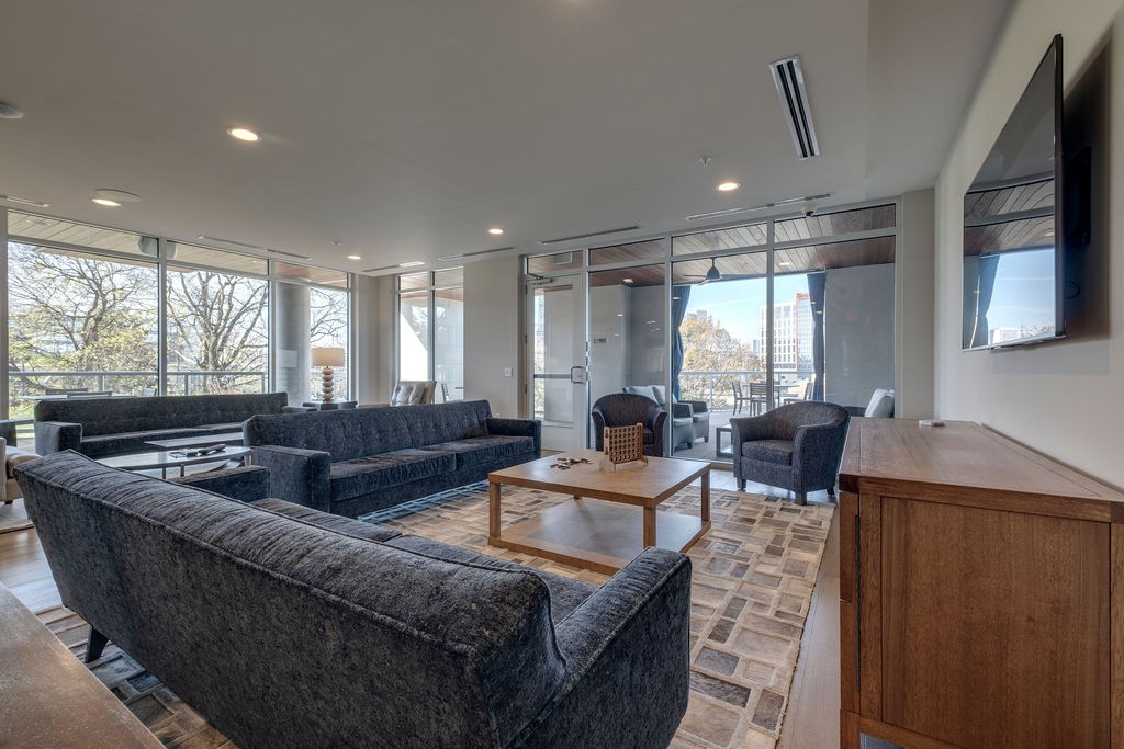 20 Rutledge Street, Unit 111 Nashville, TN 37210 - Photo 21 of 32 a living room with furniture window and flat screen tv