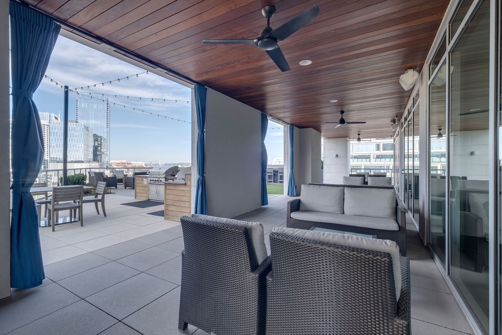 20 Rutledge Street, Unit 111 Nashville, TN 37210 - Photo 22 of 32 a living room with furniture and a view of kitchen