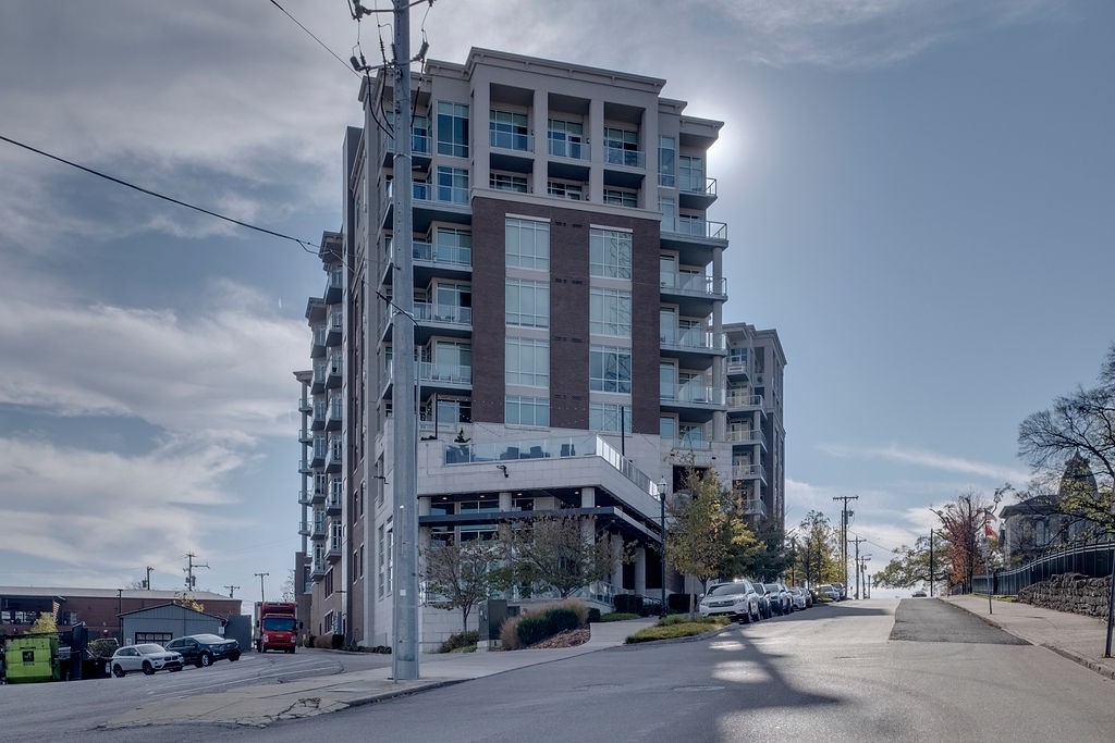 20 Rutledge Street, Unit 111 Nashville, TN 37210 - Photo 26 of 32 front view of a building with a street