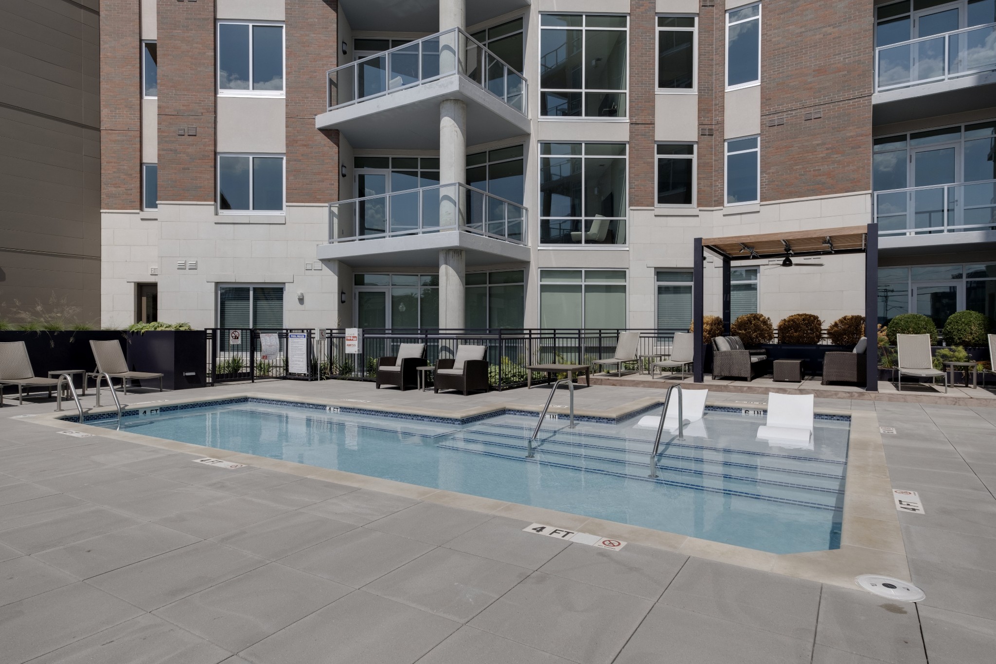 20 Rutledge Street, Unit 111 Nashville, TN 37210 - Photo 29 of 32 a view of a swimming pool with outdoor seating