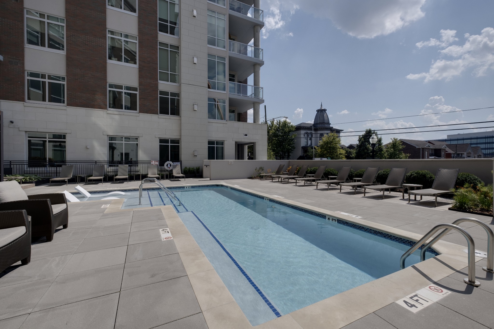 20 Rutledge Street, Unit 111 Nashville, TN 37210 - Photo 30 of 32 a view of a swimming pool with outdoor seating and buildings