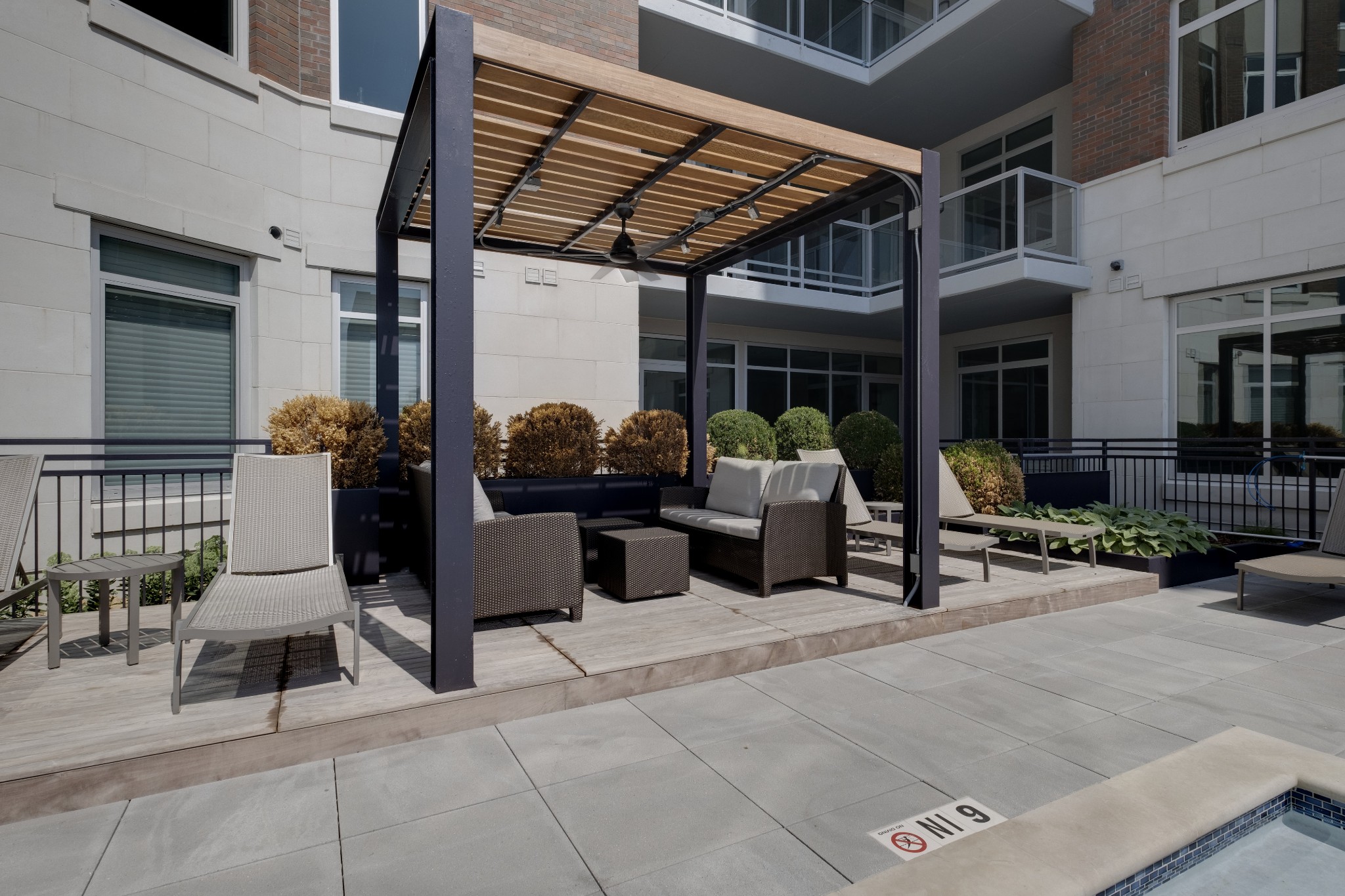 20 Rutledge Street, Unit 111 Nashville, TN 37210 - Photo 32 of 32 a building outdoor space with patio furniture and potted plants