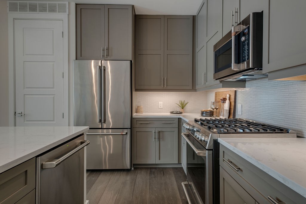 20 Rutledge Street, Unit 111 Nashville, TN 37210 - Photo 5 of 32 a kitchen with a refrigerator stove and microwave