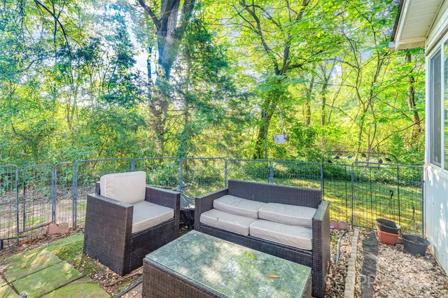 a view of a patio with a yard