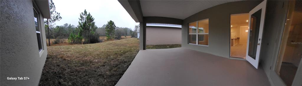 7560 Bent Tree Loop St. Cloud, FL 34773 - Photo 16 of 25 a view of a back yard