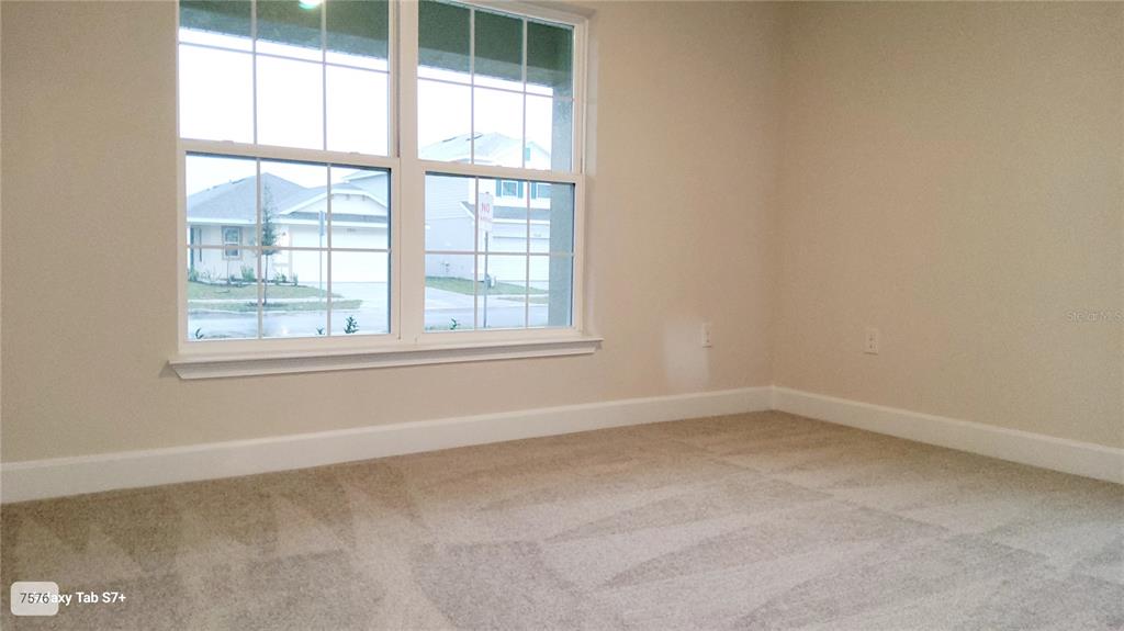 7560 Bent Tree Loop St. Cloud, FL 34773 - Photo 20 of 25 an empty room with a window