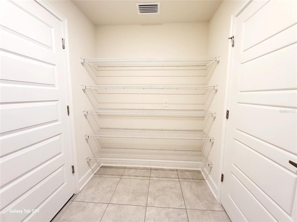 7560 Bent Tree Loop St. Cloud, FL 34773 - Photo 23 of 25 a view of walk in closet