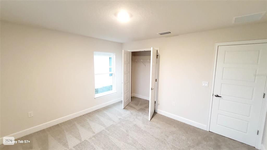 7560 Bent Tree Loop St. Cloud, FL 34773 - Photo 10 of 25 a view of an empty room and a window