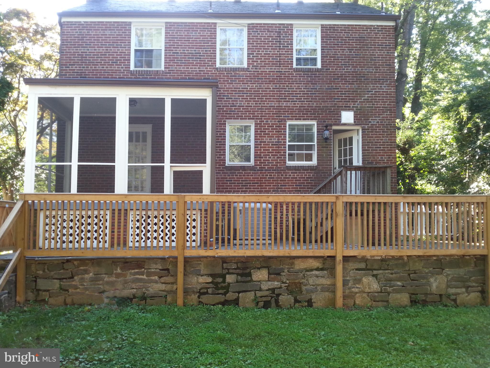 3130 38th Street Northwest Washington, DC 20016 - Photo 21 of 25 a front view of a house with a garden