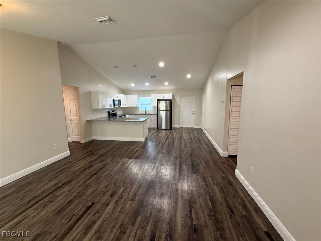3003 Harvard Circle LaBelle, FL 33935 - Photo 2 of 11 a view of a kitchen with wooden floor