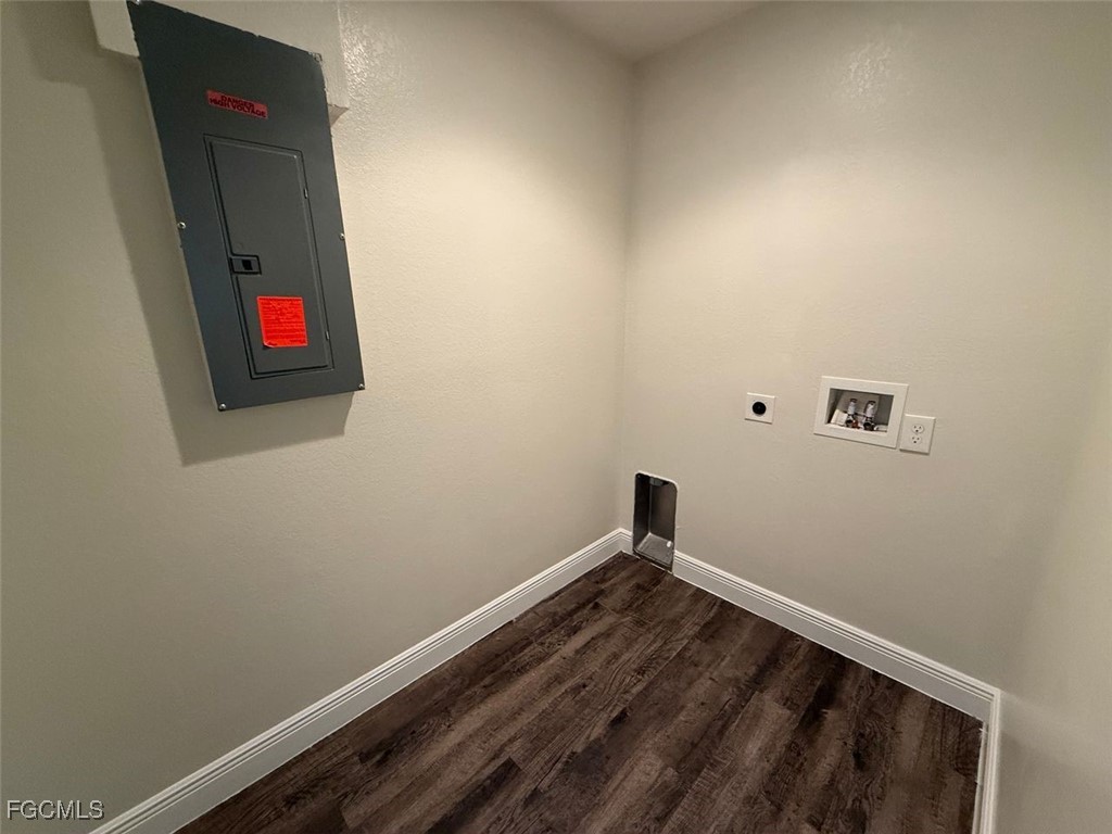 3003 Harvard Circle LaBelle, FL 33935 - Photo 10 of 11 an empty room with wooden floor and cabinets