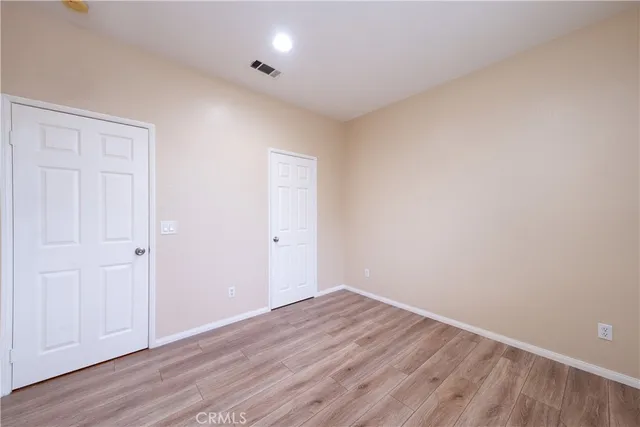 a view of room with wooden floor