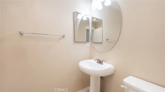 a bathroom with a sink and mirror