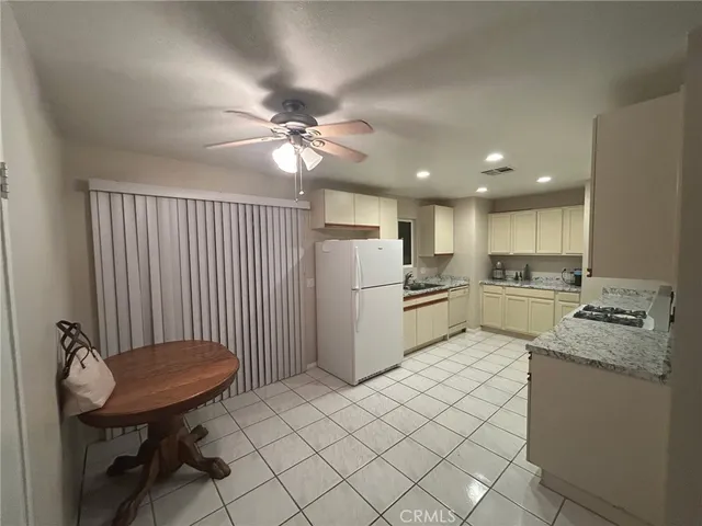 a kitchen with a sink appliances and cabinets