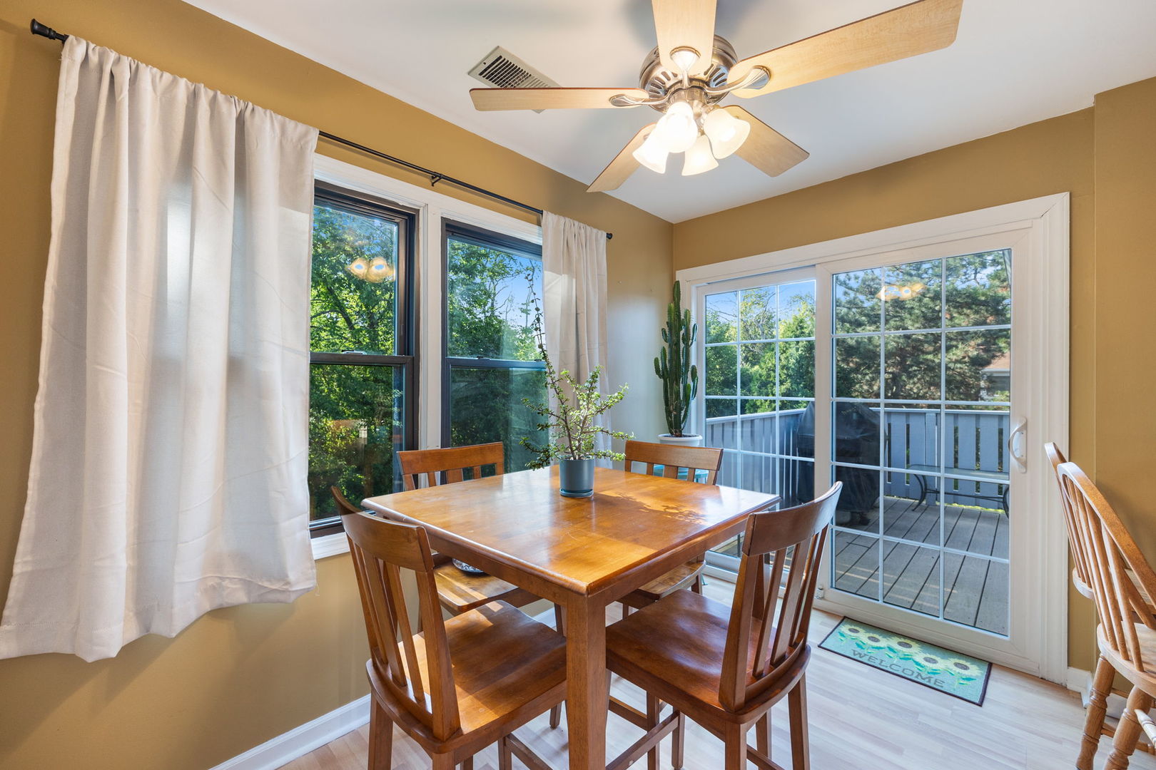 1932 Gresham Circle, Unit C Wheaton, IL 60189 - Photo 13 of 27 a view of a dining room with furniture window and wooden floor