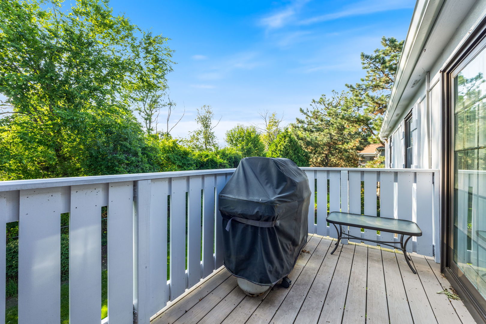 1932 Gresham Circle, Unit C Wheaton, IL 60189 - Photo 14 of 27 a view of balcony with wooden floor and fence