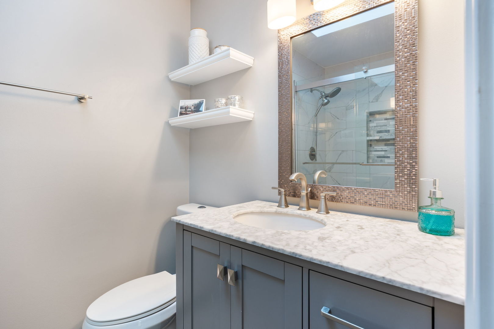 1932 Gresham Circle, Unit C Wheaton, IL 60189 - Photo 17 of 27 a bathroom with a granite countertop sink a toilet and a mirror