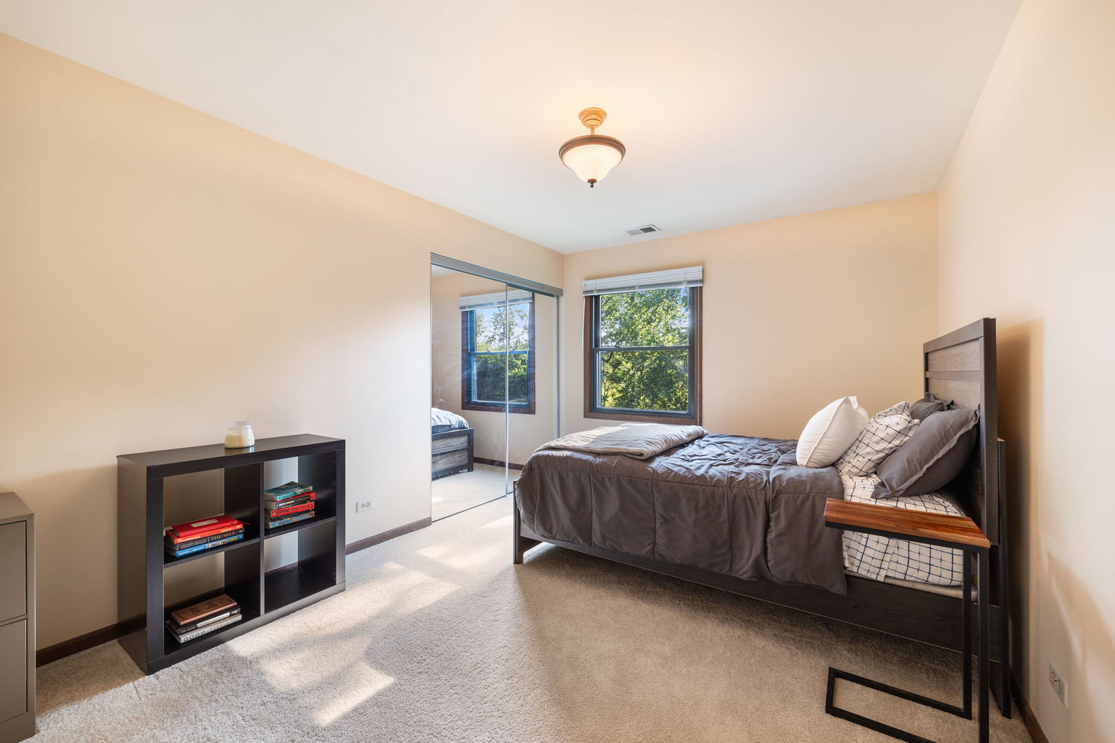 1932 Gresham Circle, Unit C Wheaton, IL 60189 - Photo 19 of 27 a living room with furniture and a flat screen tv