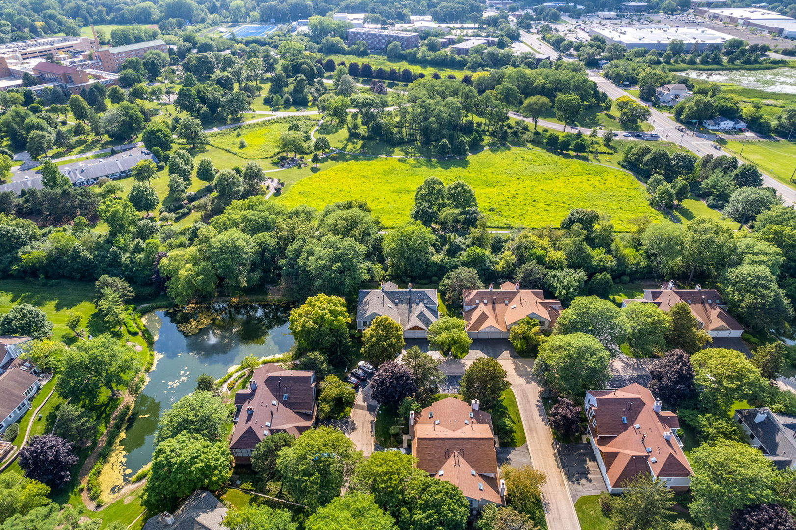 1932 Gresham Circle, Unit C Wheaton, IL 60189 - Photo 27 of 27 an aerial view of residential houses with outdoor space and swimming pool