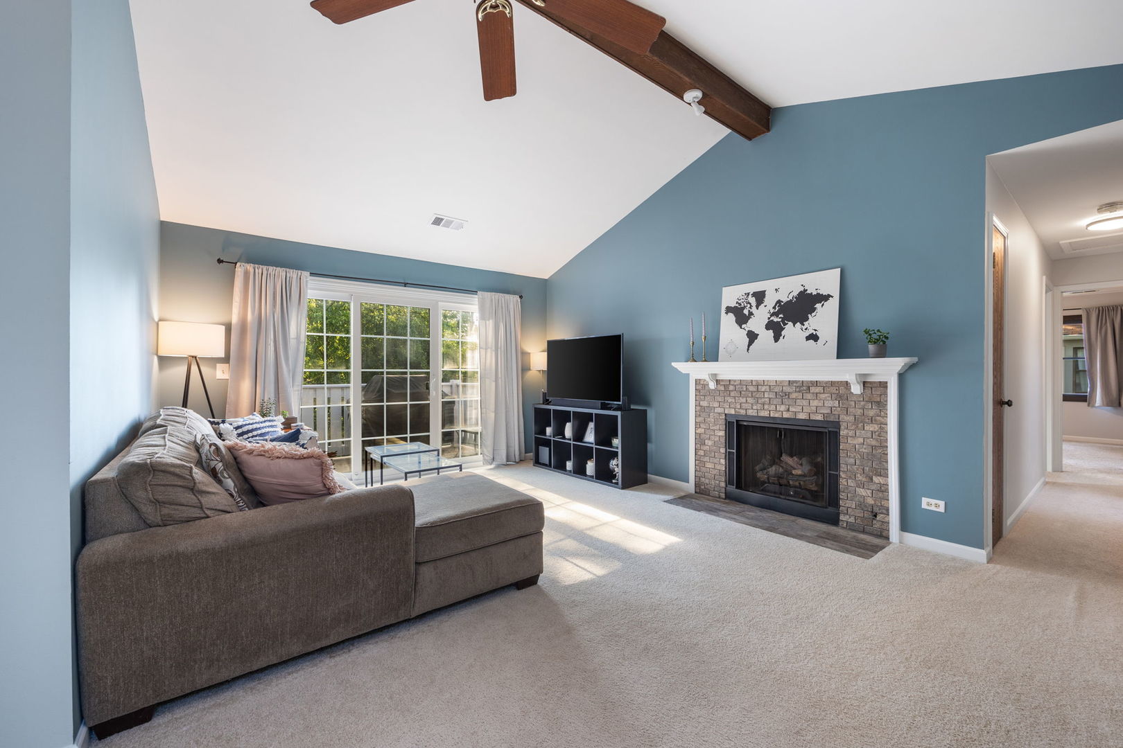 1932 Gresham Circle, Unit C Wheaton, IL 60189 - Photo 3 of 27 a living room with furniture and a fireplace
