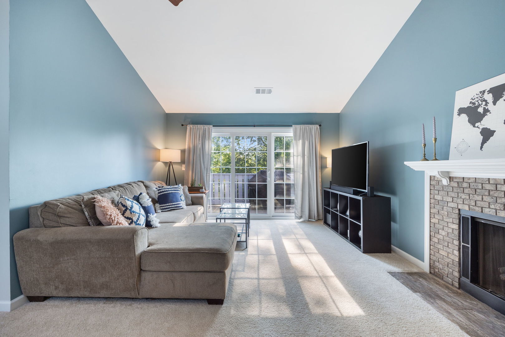 1932 Gresham Circle, Unit C Wheaton, IL 60189 - Photo 4 of 27 a living room with furniture a flat screen tv and a fireplace