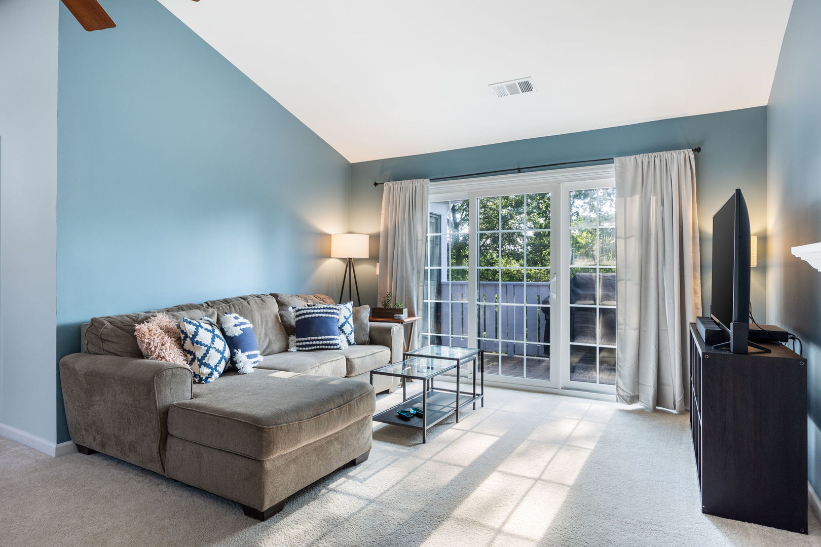 1932 Gresham Circle, Unit C Wheaton, IL 60189 - Photo 5 of 27 a living room with furniture and a flat screen tv