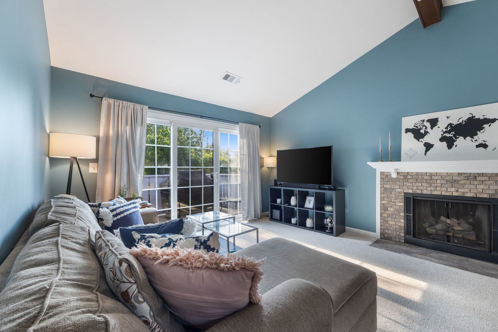 1932 Gresham Circle, Unit C Wheaton, IL 60189 - Photo 6 of 27 a living room with furniture a flat screen tv and a fireplace