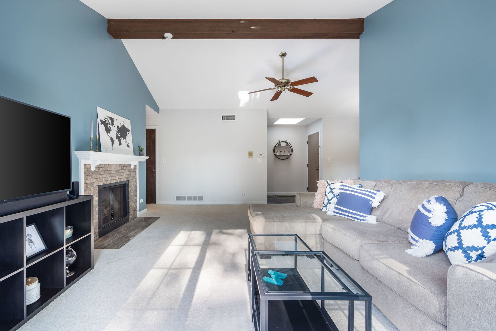 1932 Gresham Circle, Unit C Wheaton, IL 60189 - Photo 7 of 27 a living room with furniture and a flat screen tv