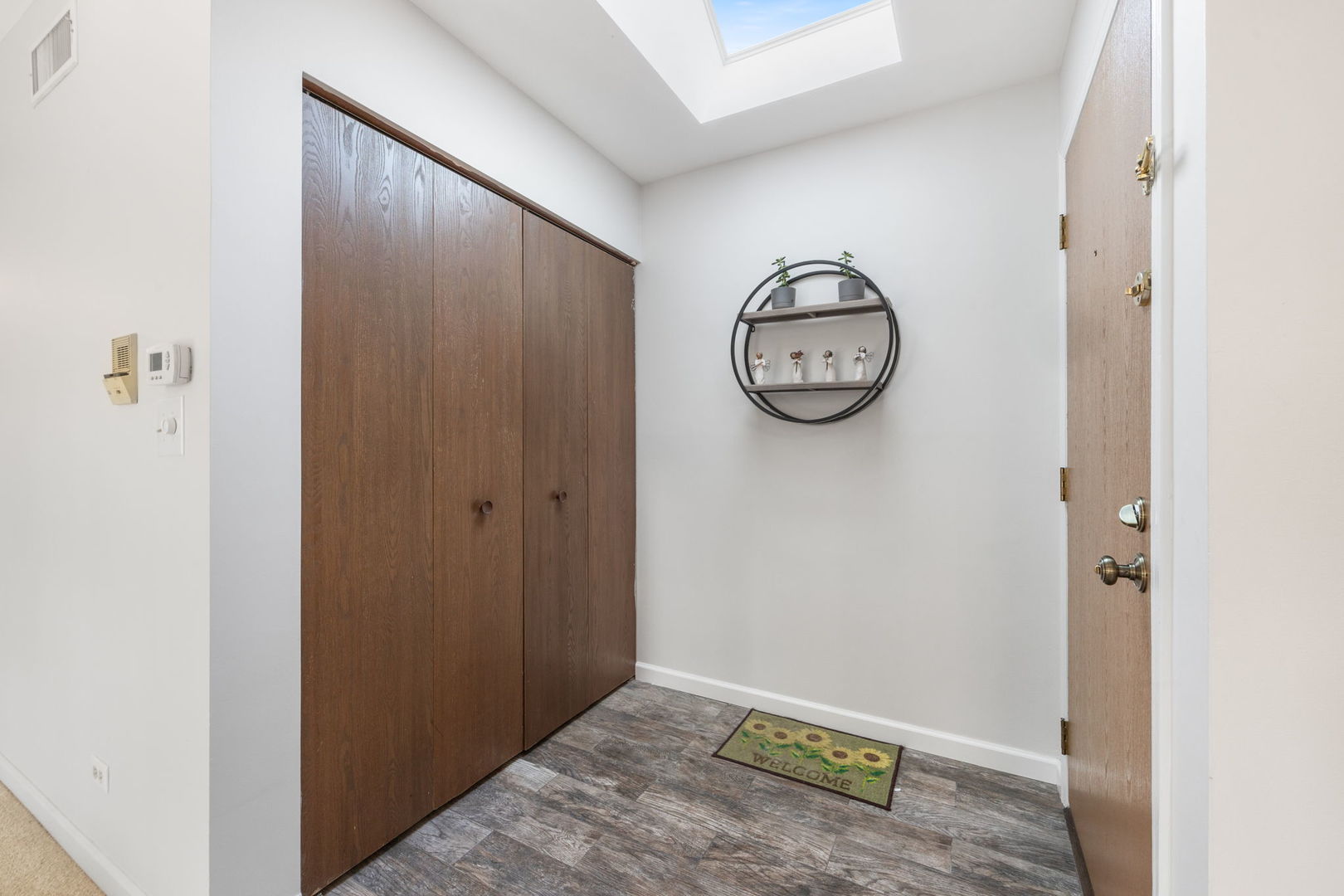 1932 Gresham Circle, Unit C Wheaton, IL 60189 - Photo 8 of 27 a view of a hallway with elevator