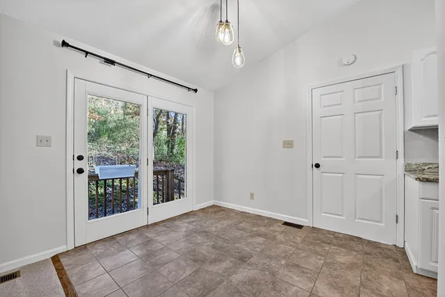 a view of a room with a large window