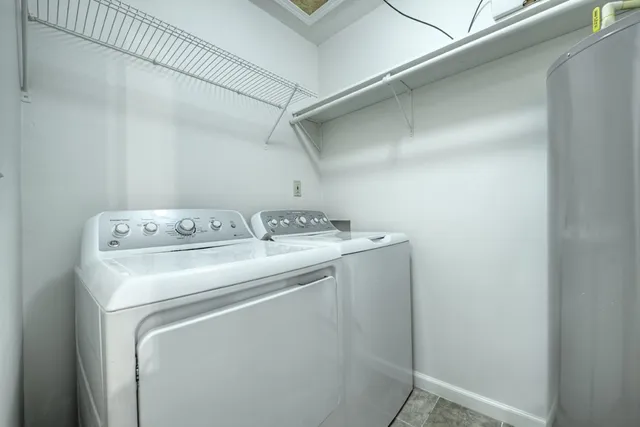 a kitchen with stainless steel appliances granite countertop a refrigerator and cabinets