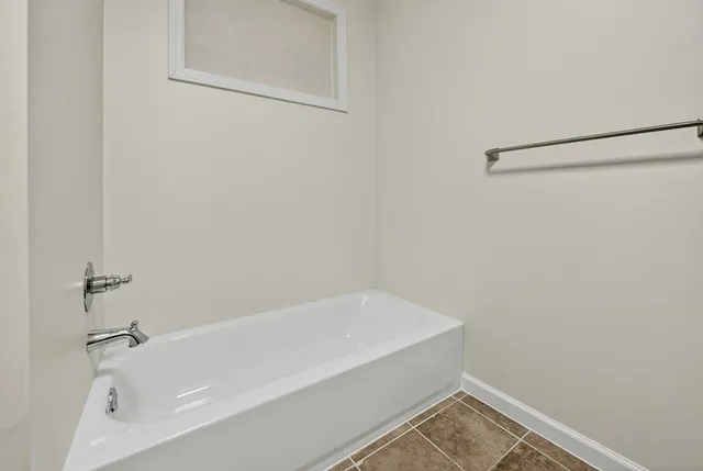a bathroom with a granite countertop sink a mirror and vanity