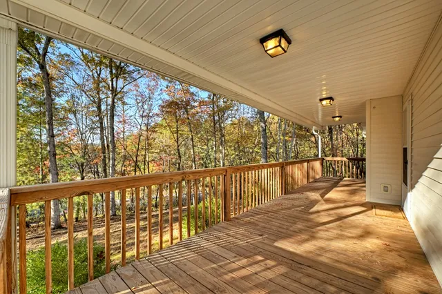 a view of balcony with wooden floor