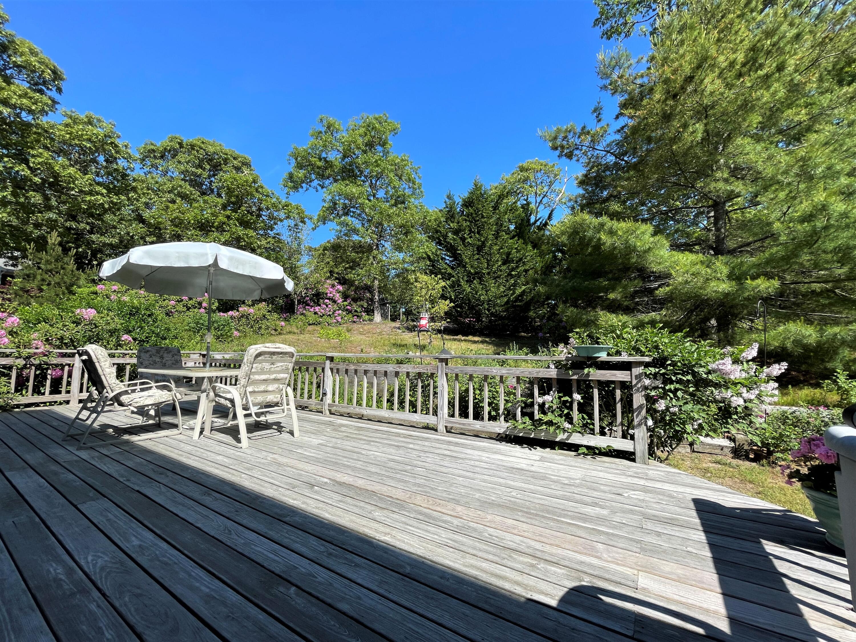 144 Long Road Harwich, MA 02645 - Photo 11 of 49 a view of a chairs with an outdoor space