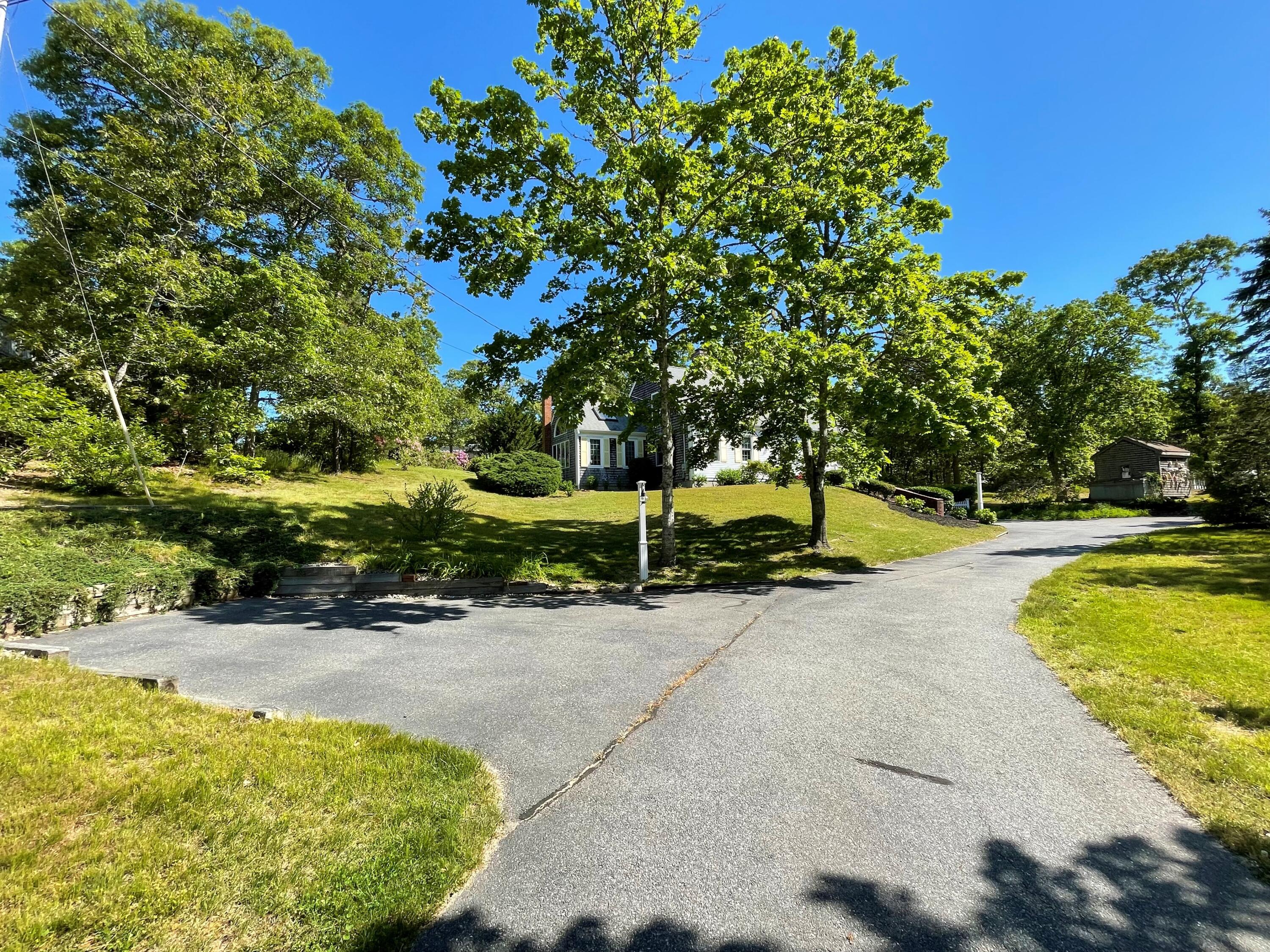 144 Long Road Harwich, MA 02645 - Photo 17 of 49 a view of swimming pool with lawn chairs and plants