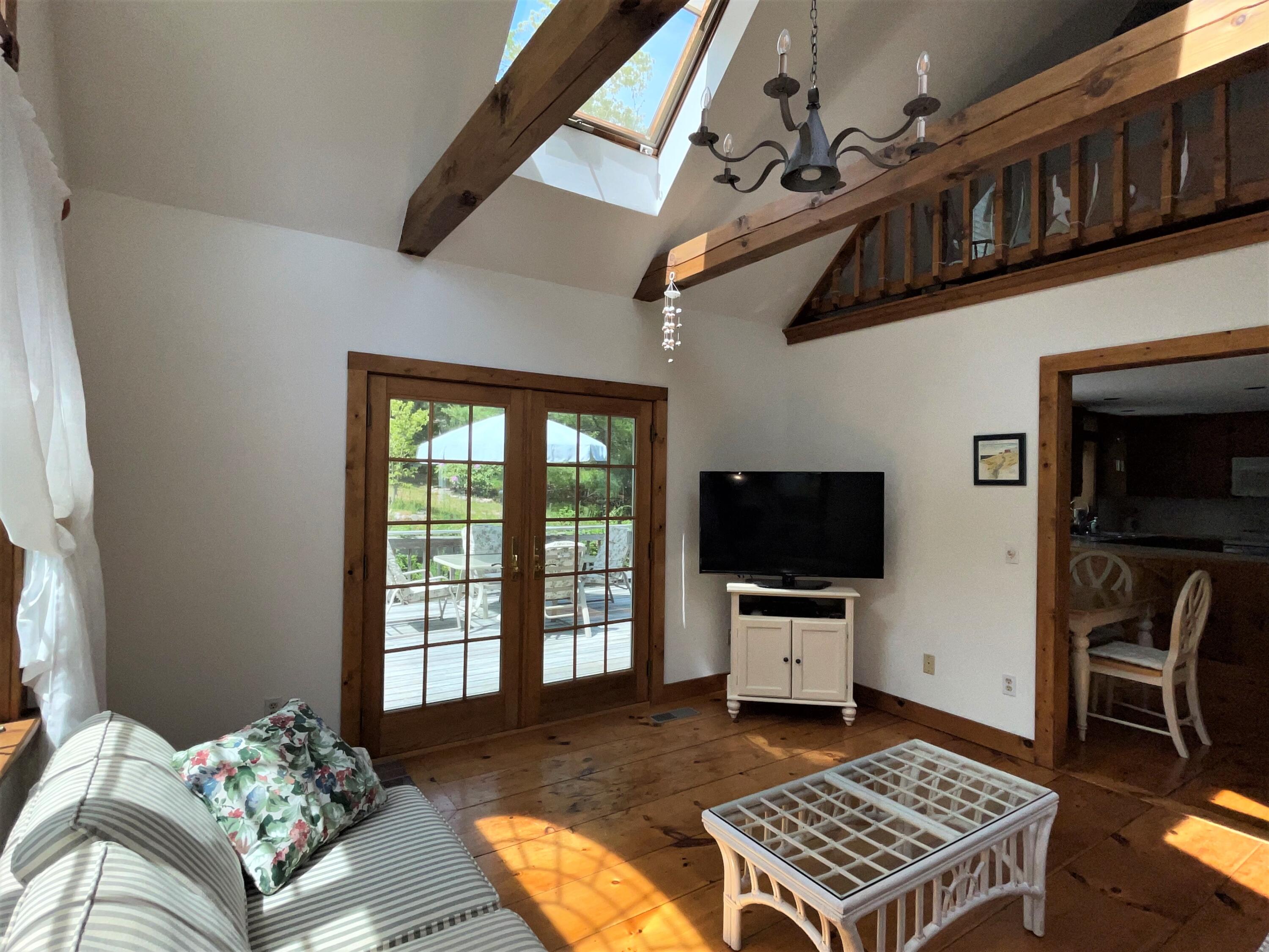 144 Long Road Harwich, MA 02645 - Photo 20 of 49 a living room with furniture and a flat screen tv
