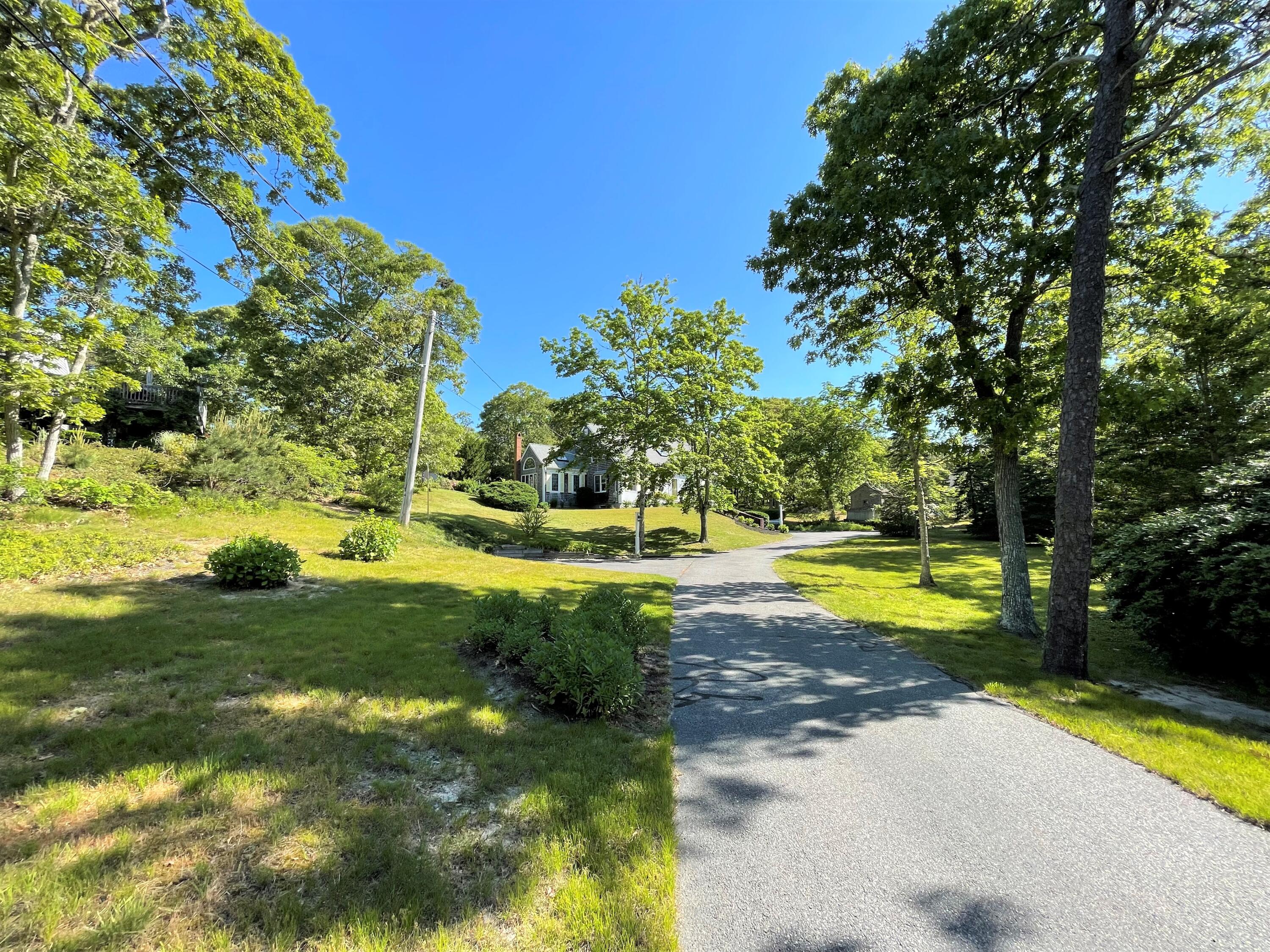 144 Long Road Harwich, MA 02645 - Photo 2 of 49 a view of swimming pool with a yard