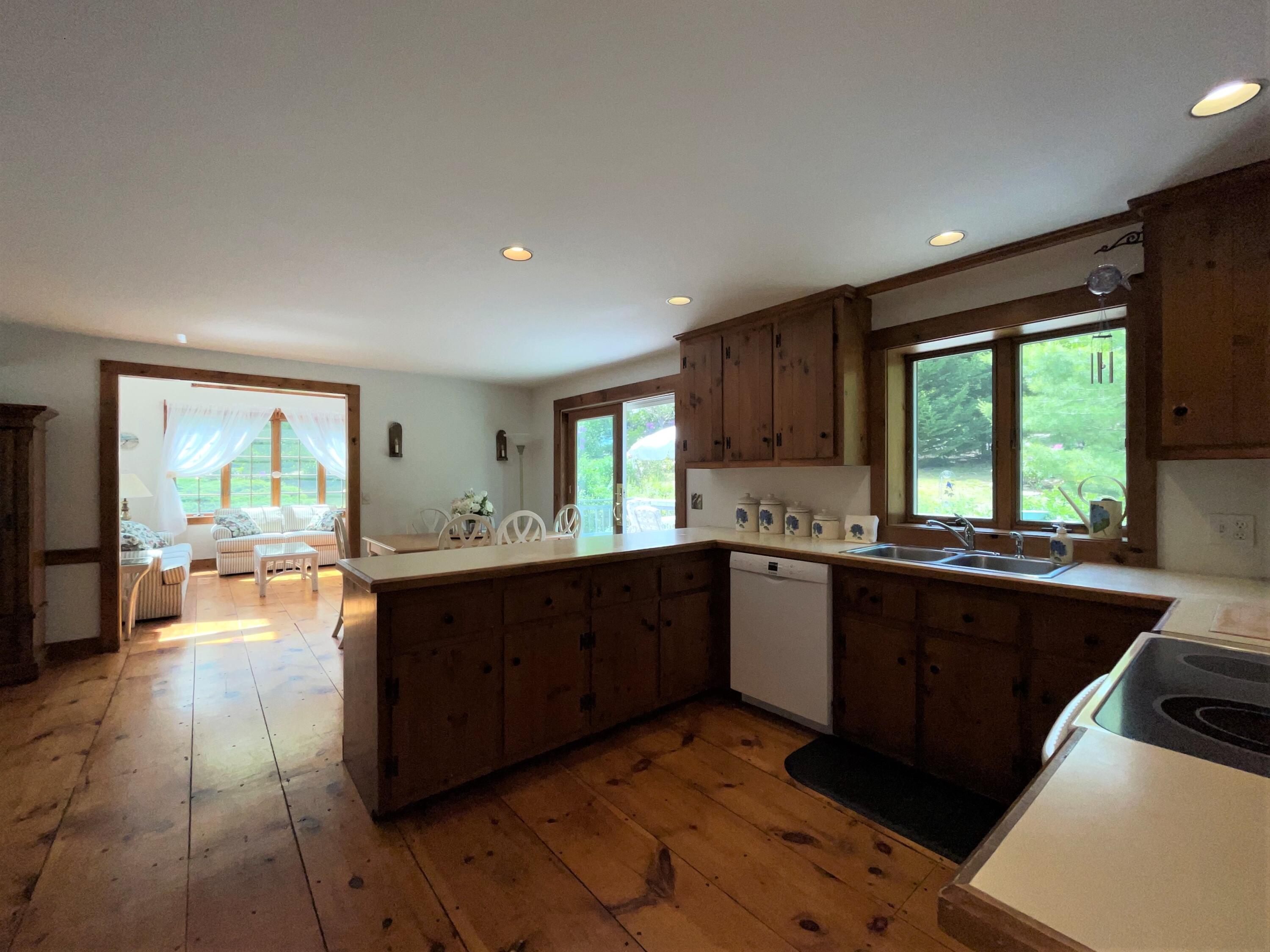 144 Long Road Harwich, MA 02645 - Photo 25 of 49 a large kitchen with lots of counter space and a sink