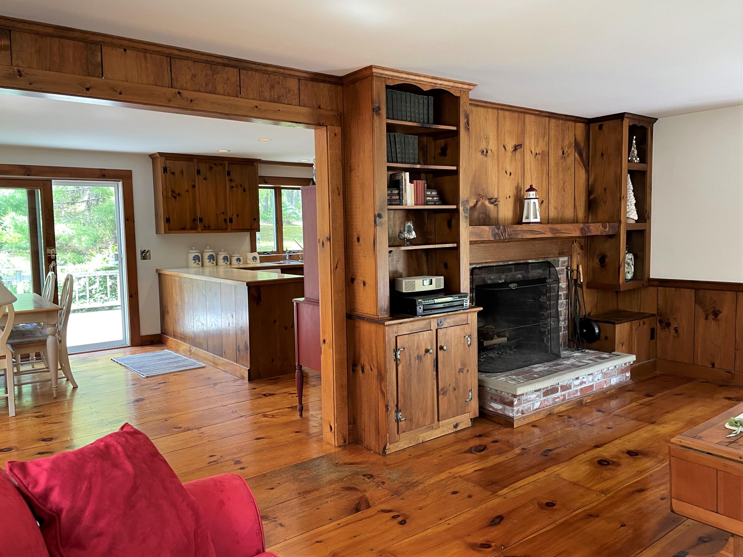 144 Long Road Harwich, MA 02645 - Photo 28 of 49 a living room with stainless steel appliances furniture a rug and a kitchen view